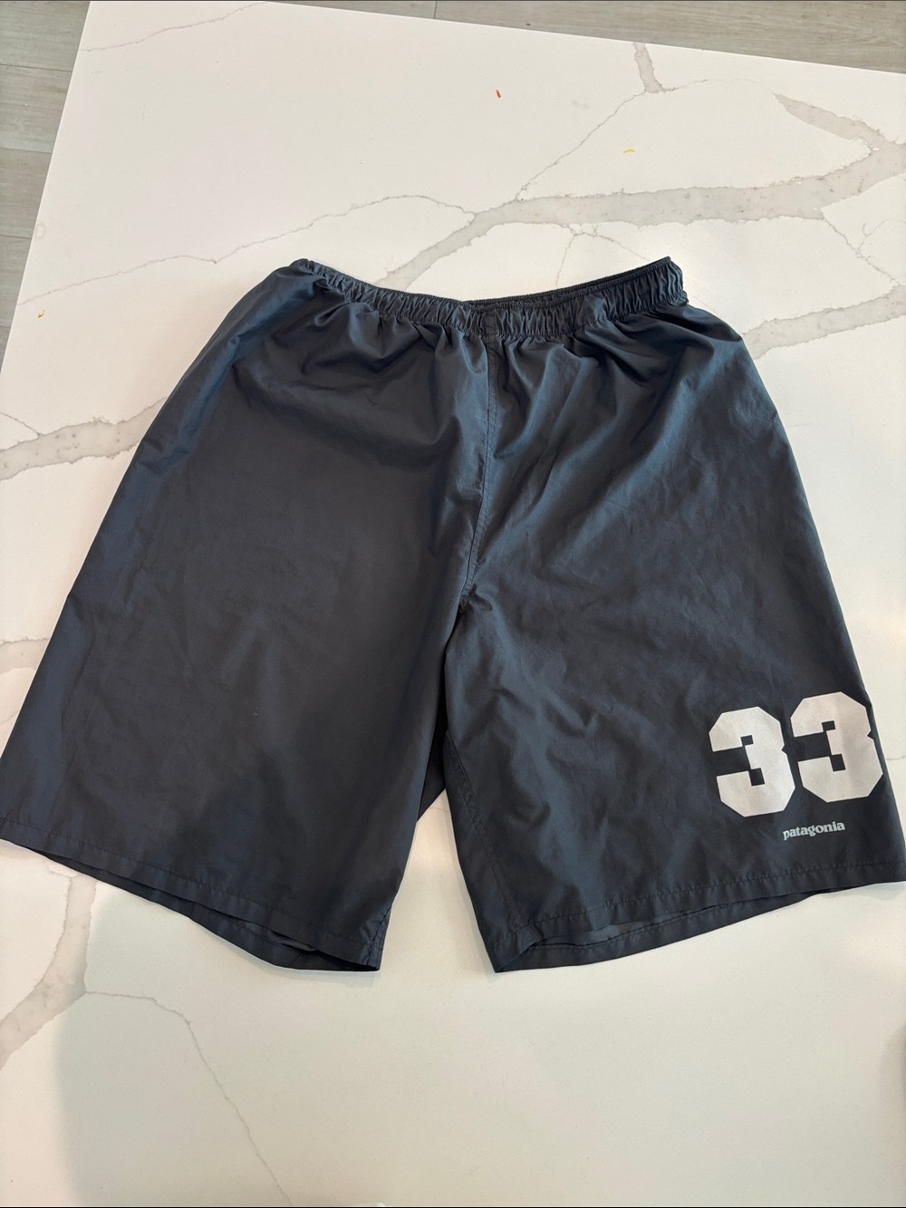 Patagonia Black Athletic Shorts with White 33 Graphic